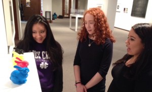 Hannah Nguyen '19, Melissa Gryan '18, and Tori Jackson '18 discuss Matthew Gamber's 3D photograph 'Stanford Bunny.'